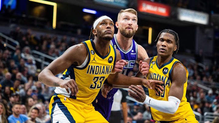 Feb 3, 2023; Indianapolis, Indiana, USA; Indiana Pacers center Myles Turner (33) and guard Bennedict Mathurin (00) box out Sacramento Kings forward Domantas Sabonis (10) in the second half at Gainbridge Fieldhouse. Mandatory Credit: Trevor Ruszkowski-Imagn Images