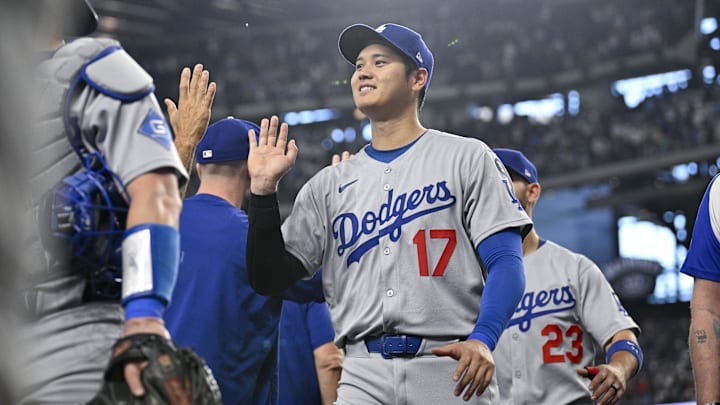Apr 20, 2025; Arlington, Texas, USA; Los Angeles Dodgers designated hitter Shohei Ohtani (17) celebrates with his teammates after the Dodgers defeat the Texas Rangers at Globe Life Field. Mandatory Credit: Jerome Miron-Imagn Images