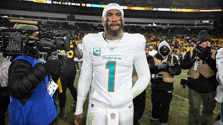 Miami Dolphins quarterback Tua Tagovailoa (1) leaves the  field following a game against the Pittsburgh Steelers at Acrisure Stadium. 