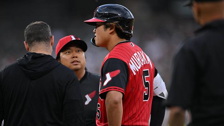May 29, 2026: Chicago White Sox first baseman Munetaka Murakami (5) looks on and chats with interpreter Kenzo Yagi (center) before being taken out of the game on a hamstring injury during the third inning against the Detroit Tigers at Rate Field. 