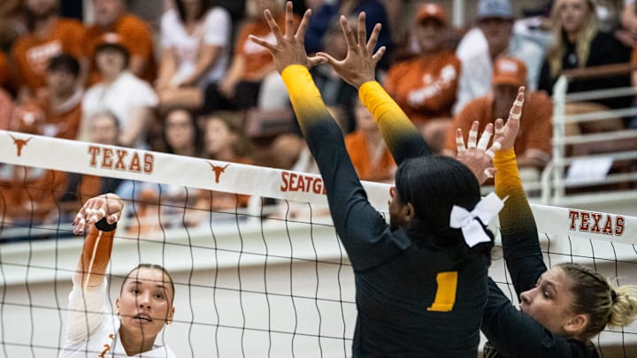 Texas Longhorns outside hitter Madisen Skinner (6) hits the ball over the net during the Longhorns' match-up with the Missouri Tigers at the Gregory Gym in Austin, Nov. 1, 2024.