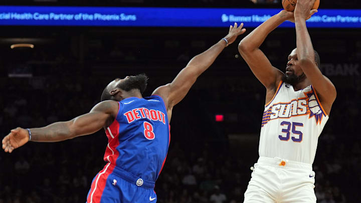 Oct 11, 2024; Phoenix, Arizona, USA; Phoenix Suns forward Kevin Durant (35) shoots over Detroit Pistons forward Tim Hardaway Jr. (8) during the first half at Footprint Center. Mandatory Credit: Joe Camporeale-Imagn Images