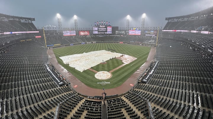 Mar 30, 2025; Chicago, Illinois, USA; A tarp covers the field during a rain delay in the seventh inning of a game between the Chicago White Sox and the Los Angeles Angels at Guaranteed Rate Field. Mandatory Credit: David Banks-Imagn Images