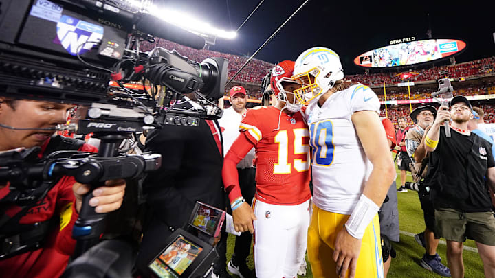 Sep 15, 2022; Kansas City, Missouri, USA; Los Angeles Chargers quarterback Justin Herbert (10) meets with Kansas City Chiefs quarterback Patrick Mahomes (15) following the game at GEHA Field at Arrowhead Stadium. Mandatory Credit: Jay Biggerstaff-Imagn Images