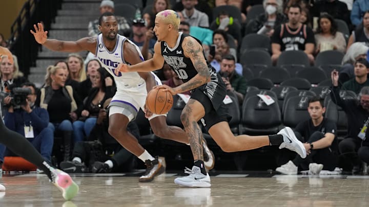 Jan 15, 2023; San Antonio, Texas, USA;  San Antonio Spurs forward Jeremy Sochan (10) dribbles against Sacramento Kings forward Harrison Barnes (40) in the second half at the AT&T Center. Mandatory Credit: Daniel Dunn-USA TODAY Sports