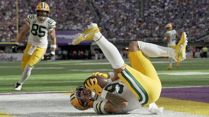 Green Bay Packers wide receiver Christian Watson (9) makes a touchdown reception against the Minnesota Vikings. Green Bay Packers wide receiver Christian Watson (9) makes a touchdown reception against the Minnesota Vikings.