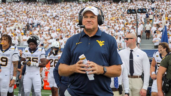 Sep 5, 2026; Morgantown, West Virginia, USA;  West Virginia Mountaineers head coach Rich Rodriguez walks the sidelines during the first quarter against the Coastal Carolina Chanticleers at Milan Puskar Stadium.  Mandatory Credit: Ben Queen-Imagn Images