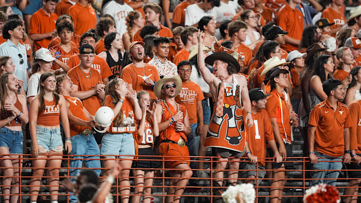 Texas Longhorns fans celebrate in the second half of the game against the Louisiana Monroe Warhawks at Darrell K Royal-Texas Memorial Stadium. Texas Longhorns fans celebrate in the second half of the game against the Louisiana Monroe Warhawks at Darrell K Royal-Texas Memorial Stadium.