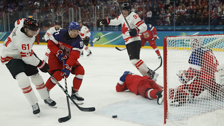 Feb 12, 2026; Milan, Italy; Team Canada forward Mark Stone (61) scores a goal on Team Czechia goalkeeper Lukas Dostal (1) as Team Czechia forward Dominik Kubalik (81) and Team Canada forward Mitch Marner (93) look on in the first period during the Milano Cortina 2026 Olympic Winter Games at Milano Santagiulia Ice Hockey Arena. Mandatory Credit: Geoff Burke-Imagn Images
