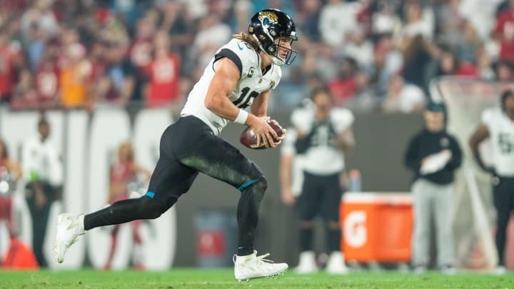 Dec 24, 2023; Tampa, Florida, USA; Jacksonville Jaguars quarterback Trevor Lawrence (16) runs the ball against the Tampa Bay Buccaneers in the third quarter at Raymond James Stadium. Mandatory Credit: Jeremy Reper-USA TODAY Sports Dec 24, 2023; Tampa, Florida, USA; Jacksonville Jaguars quarterback Trevor Lawrence (16) runs the ball against the Tampa Bay Buccaneers in the third quarter at Raymond James Stadium. Mandatory Credit: Jeremy Reper-USA TODAY Sports