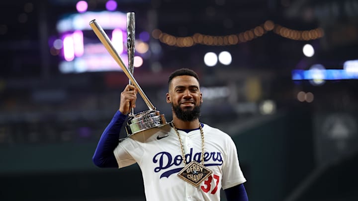 Jul 15, 2024; Arlington, TX, USA; National League outfielder Teoscar Hernandez of the Los Angeles Dodgers (37) poses with the trophy after winning the 2024 Home Run Derby at Globe Life Field.