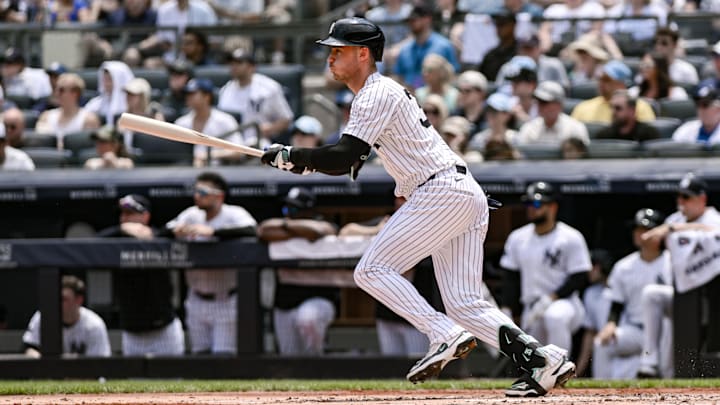 Jun 21, 2025; Bronx, New York, USA; New York Yankees outfielder Cody Bellinger (35) hits a single against the Baltimore Orioles during the first inning at Yankee Stadium. Mandatory Credit: John Jones-Imagn Images