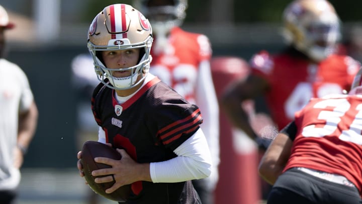 Jun 11, 2025; Santa Clara, CA, USA; San Francisco 49ers quarterback Brock Purdy (13) rolls out to pass during a team OTA at Levi's Stadium. Mandatory Credit: D. Ross Cameron-Imagn Images