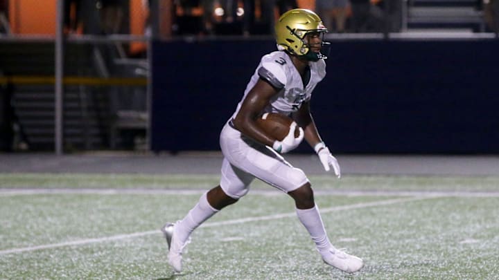 Iowa City West’s Julian Manson runs with the ball against Iowa City Liberty Friday, Aug. 30, 2024 in North Liberty, Iowa. Iowa City West’s Julian Manson runs with the ball against Iowa City Liberty Friday, Aug. 30, 2024 in North Liberty, Iowa.