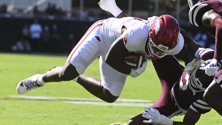 Arkansas Razorbacks running back Braylen Russell (0) is stopped short of the end zone by Mississippi State Bulldogs safety Isaac Smith (2) and cornerback Brice Pollock (14) during the first quarter at Davis Wade Stadium at Scott Field.