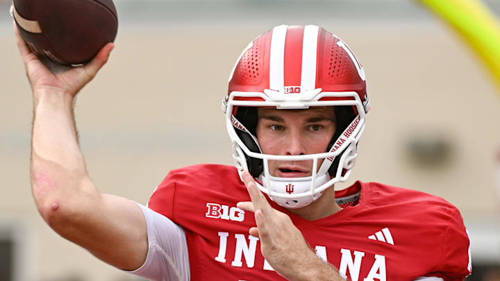 Oct 18, 2025; Bloomington, Indiana, USA; Indiana Hoosiers quarterback Fernando Mendoza (15) warms up prior to the game against the Michigan State Spartans at Memorial Stadium. Mandatory Credit: Robert Goddin-Imagn Images