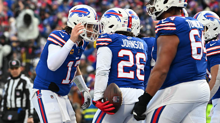 Jan 12, 2025; Orchard Park, New York, USA; Buffalo Bills quarterback Josh Allen (17) celebrates a touchdown with running back Ty Johnson (26) during the third quarter against the Denver Broncos in an AFC wild card game at Highmark Stadium. Jan 12, 2025; Orchard Park, New York, USA; Buffalo Bills quarterback Josh Allen (17) celebrates a touchdown with running back Ty Johnson (26) during the third quarter against the Denver Broncos in an AFC wild card game at Highmark Stadium.