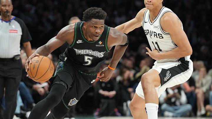 May 15, 2026; Minneapolis, Minnesota, USA; Minnesota Timberwolves guard Anthony Edwards (5) dribbles the ball past San Antonio Spurs forward Carter Bryant (11) in the second half during game six of the second round of the 2026 NBA Playoffs at Target Center. Mandatory Credit: Jesse Johnson-Imagn Images May 15, 2026; Minneapolis, Minnesota, USA; Minnesota Timberwolves guard Anthony Edwards (5) dribbles the ball past San Antonio Spurs forward Carter Bryant (11) in the second half during game six of the second round of the 2026 NBA Playoffs at Target Center. Mandatory Credit: Jesse Johnson-Imagn Images