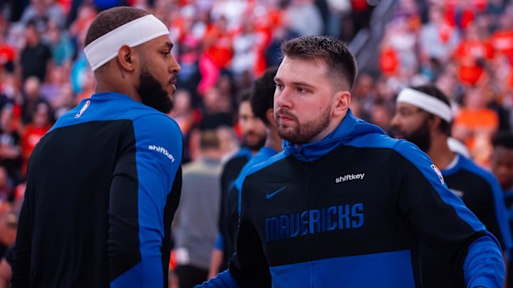 Oct 26, 2024; Phoenix, Arizona, USA; Dallas Mavericks guard Luka Doncic (right) with center Daniel Gafford against the Phoenix Suns at Footprint Center. Mandatory Credit: Mark J. Rebilas-Imagn Images