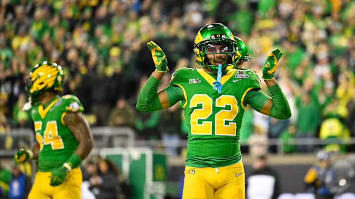Dec 20, 2025; Eugene, OR, USA;  Oregon Ducks defensive back Jadon Canady (22) celebrates after a play during the second quarter against the James Madison Dukes at Autzen Stadium. Mandatory Credit: Troy Wayrynen-Imagn Images