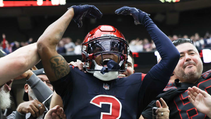 Nov 19, 2023; Houston, Texas, USA;  Houston Texans wide receiver Tank Dell (3) jumps in the stands and celebrates his touchdown against the Arizona Cardinals in the second quarter at NRG Stadium. Mandatory Credit: Thomas Shea-USA TODAY Sports