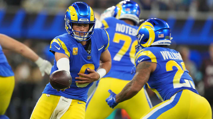 Nov 11, 2024; Inglewood, California, USA; Los Angeles Rams quarterback Matthew Stafford (9) hands the ball off to running back Kyren Williams (23) against the Miami Dolphins in the first half at SoFi Stadium. Mandatory Credit: Kirby Lee-Imagn Images Nov 11, 2024; Inglewood, California, USA; Los Angeles Rams quarterback Matthew Stafford (9) hands the ball off to running back Kyren Williams (23) against the Miami Dolphins in the first half at SoFi Stadium. Mandatory Credit: Kirby Lee-Imagn Images