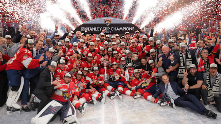 Jun 17, 2025; Sunrise, Florida, USA; The Florida Panthers pose for a photo with the Stanley Cup after winning game six of the 2025 Stanley Cup Final against the Edmonton Oilers at Amerant Bank Arena. Mandatory Credit: Sam Navarro-Imagn Images