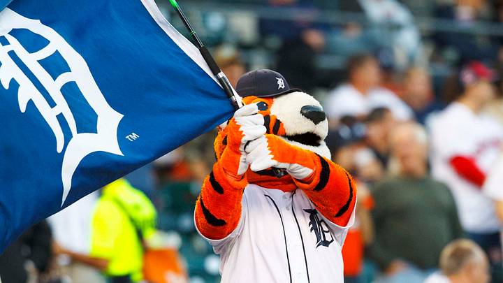 Detroit Tigers mascot Paws waves a flag. Detroit Tigers mascot Paws waves a flag.