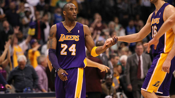 Mar 12, 2011; Dallas, TX, USA; Los Angeles Lakers guard Kobe Bryant (24) celebrates at the end of the game with Pau Gasol (16)against the Dallas Mavericks at American Airlines Center. The Lakers beat the Mavs 96-91. Mandatory Credit: Matthew Emmons-Imagn Images