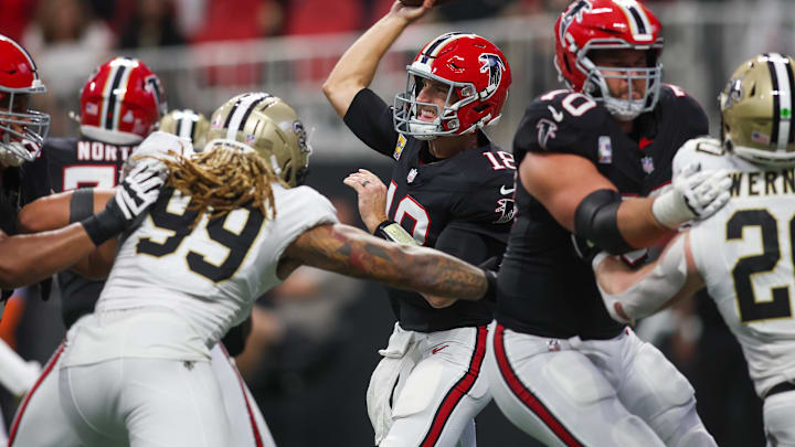 Sep 29, 2024; Atlanta, Georgia, USA; Atlanta Falcons quarterback Kirk Cousins (18) throws a pass against the New Orleans Saints in the fourth quarter at Mercedes-Benz Stadium. Mandatory Credit: Brett Davis-Imagn Images