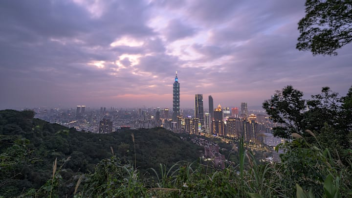 An elevated view of Taipei city during twilight with...
