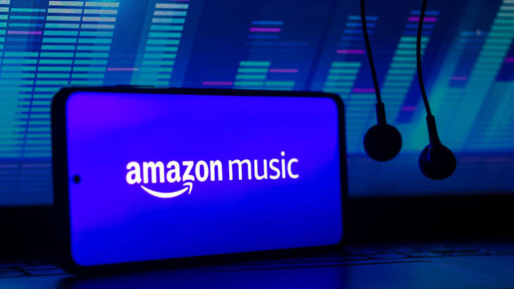 In this photo illustration the streaming service logo Amazon...