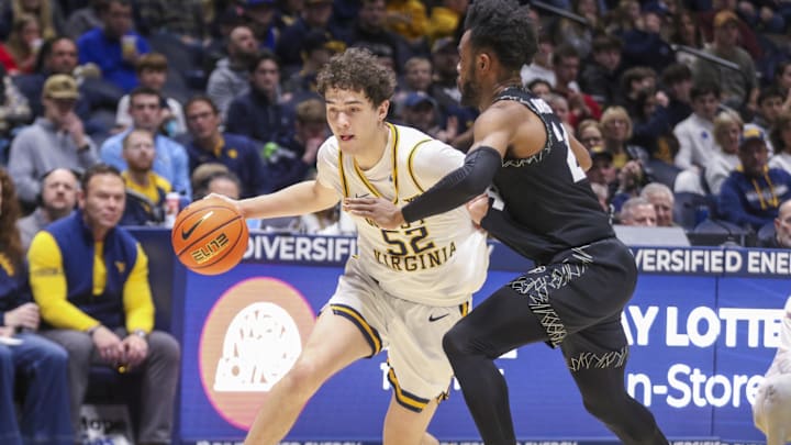 Jan 17, 2026; Morgantown, West Virginia, USA; West Virginia Mountaineers guard Treysen Eaglestaff (52) dribbles against Colorado Buffaloes guard Barrington Hargress (24) during the second half at Hope Coliseum. Mandatory Credit: Ben Queen-Imagn Images