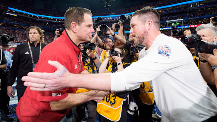 Oregon head coach Dan Lanning, right, and Indiana head coach Curt Cignetti shake hands as the Oregon Ducks face the Indiana Hoosiers in the Peach Bowl on Jan. 9, 2026, at Mercedes-Benz Stadium in Atlanta, Georgia. Oregon head coach Dan Lanning, right, and Indiana head coach Curt Cignetti shake hands as the Oregon Ducks face the Indiana Hoosiers in the Peach Bowl on Jan. 9, 2026, at Mercedes-Benz Stadium in Atlanta, Georgia.