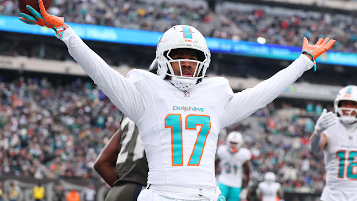 Dec 7, 2025; East Rutherford, New Jersey, USA; Miami Dolphins wide receiver Jaylen Waddle (17) reacts after making a catch for a touchdown against the New York Jets during the first half at MetLife Stadium. Mandatory Credit: Ed Mulholland-Imagn Images
