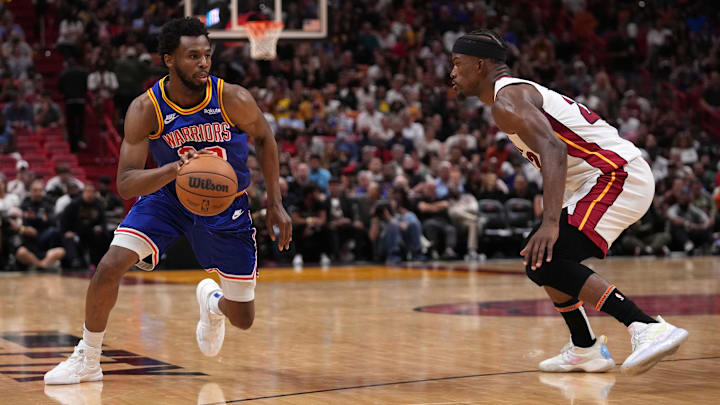 Mar 23, 2022; Miami, Florida, USA; Golden State Warriors forward Andrew Wiggins (22) drives the ball around Miami Heat forward Jimmy Butler (22) during the second half at FTX Arena. Mandatory Credit: Jasen Vinlove-Imagn Images Mar 23, 2022; Miami, Florida, USA; Golden State Warriors forward Andrew Wiggins (22) drives the ball around Miami Heat forward Jimmy Butler (22) during the second half at FTX Arena. Mandatory Credit: Jasen Vinlove-Imagn Images