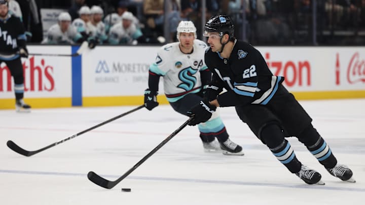 Apr 8, 2025; Salt Lake City, Utah, USA; Utah Hockey Club center Jack McBain (22) skates with the puck against the Seattle Kraken during the third period at Delta Center. Mandatory Credit: Rob Gray-Imagn Images