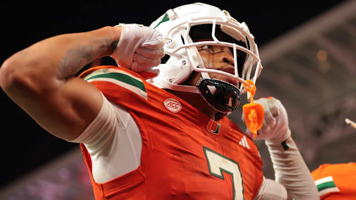 Sep 6, 2025; Miami Gardens, Florida, USA; Miami Hurricanes wide receiver CJ Daniels (7) celebrates after scoring a touchdown against the Bethune-Cookman Wildcats during the second quarter at Hard Rock Stadium. Mandatory Credit: Sam Navarro-Imagn Images