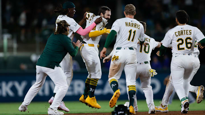 Sep 26, 2025; West Sacramento, California, USA; Athletics catcher Shea Langeliers (23) celebrates with teammates after hitting a walk-off RBI double during the ninth inning against the Kansas City Royals at Sutter Health Park. Mandatory Credit: Sergio Estrada-Imagn Images