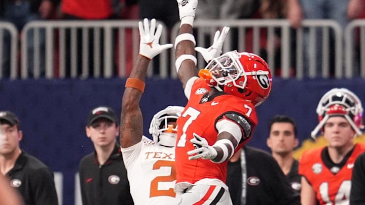 Dec 7, 2024; Atlanta, GA, USA; Texas Longhorns wide receiver Matthew Golden (2) makes a catch against Georgia Bulldogs defensive back Daniel Harris (7) during the first half in the 2024 SEC Championship game at Mercedes-Benz Stadium. Mandatory Credit: Dale Zanine-Imagn Images Dec 7, 2024; Atlanta, GA, USA; Texas Longhorns wide receiver Matthew Golden (2) makes a catch against Georgia Bulldogs defensive back Daniel Harris (7) during the first half in the 2024 SEC Championship game at Mercedes-Benz Stadium. Mandatory Credit: Dale Zanine-Imagn Images