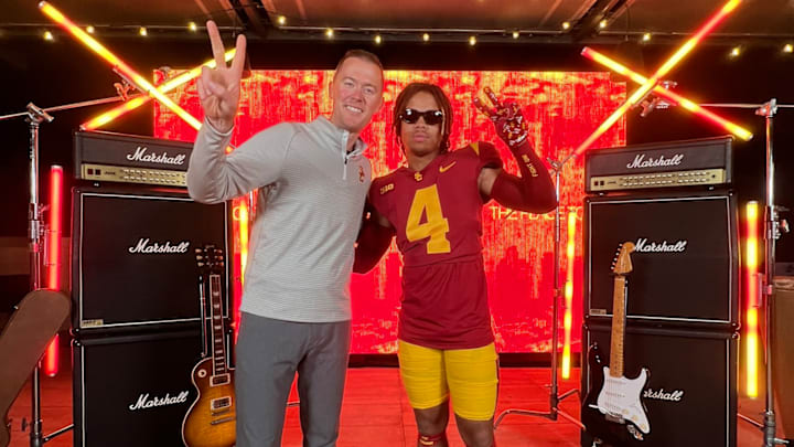 Oaks Christian 2026 running back Deshonne Redeaux posing with USC head coach Lincoln Riley on June 17, 2023. 