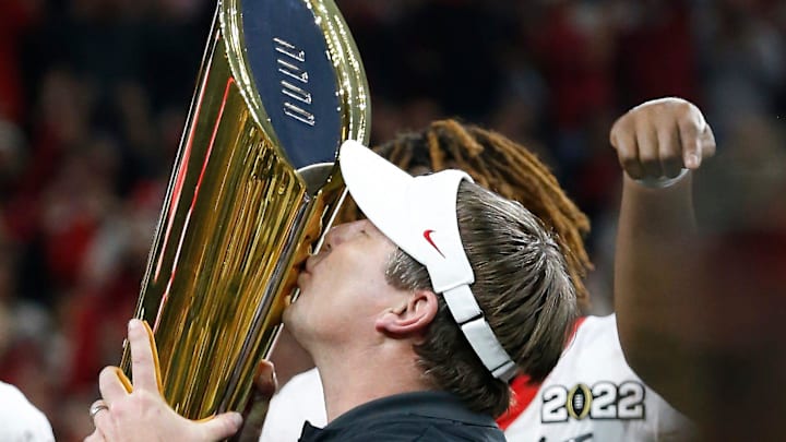 Georgia coach Kirby Smart kisses the trophy of the College Football Playoff National Championship game