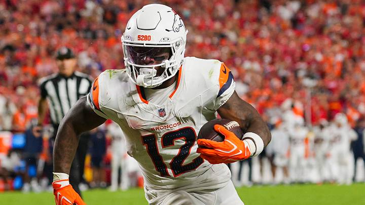 Denver Broncos running back RJ Harvey (12) runs the ball during the second half against the Kansas City Chiefs at Arrowhead Stadium. Mandatory Credit: Jay Biggerstaff-Imagn Images