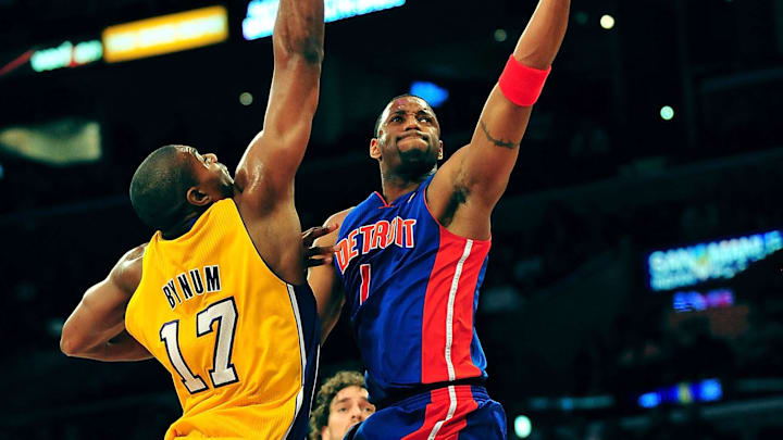 January 4, 2011; Los Angeles, CA, USA; Detroit Pistons shooting guard Tracy McGrady (1) goes in for a basket against the defense of Los Angeles Lakers center Andrew Bynum (17) during the first half at the Staples Center. Mandatory Credit: Gary A. Vasquez-Imagn Images