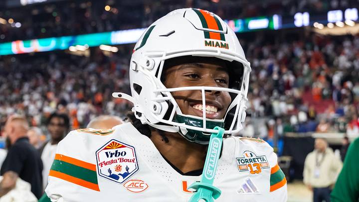 Jan 8, 2026; Glendale, AZ, USA; Miami Hurricanes defensive back Bryce Fitzgerald (13) celebrates after defeating the Mississippi Rebels during the 2026 Fiesta Bowl and semifinal game of the College Football Playoff at State Farm Stadium. Mandatory Credit: Mark J. Rebilas-Imagn Images