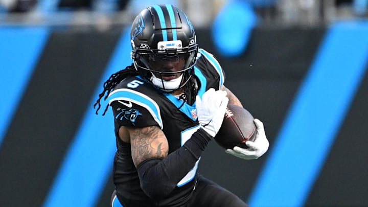 Dec 21, 2025; Charlotte, North Carolina, USA; Carolina Panthers running back Rico Dowdle (5) with the ball in the fourth quarter at Bank of America Stadium. Mandatory Credit: Bob Donnan-Imagn Images