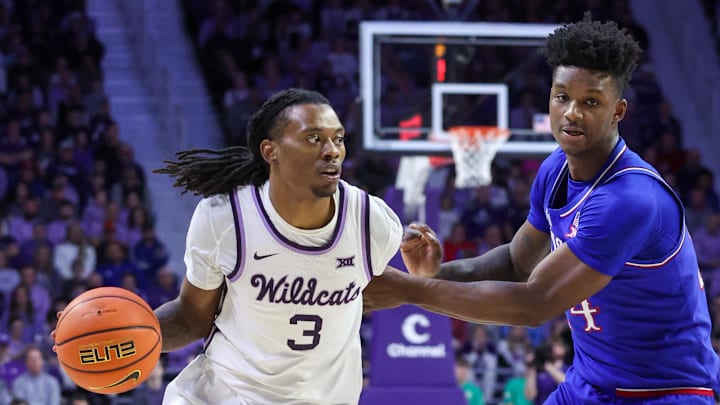 Feb 8, 2025; Manhattan, Kansas, USA; Kansas State Wildcats guard C.J. Jones (3) dribbles against Kansas Jayhawks forward K.J. Adams (24) during the first half at Bramlage Coliseum. Mandatory Credit: Scott Sewell-Imagn Images Feb 8, 2025; Manhattan, Kansas, USA; Kansas State Wildcats guard C.J. Jones (3) dribbles against Kansas Jayhawks forward K.J. Adams (24) during the first half at Bramlage Coliseum. Mandatory Credit: Scott Sewell-Imagn Images