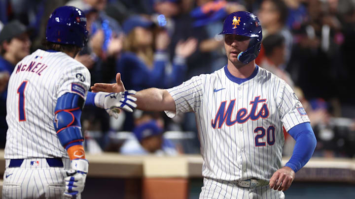 Oct 18, 2024; New York City, New York, USA; New York Mets first baseman Pete Alonso (20) celebrates scoring on an RBI from right fielder Starling Marte (6, not pictured) with New York Mets second baseman Jeff McNeil (1) during the eighth inning against the Los Angeles Dodgers during game five of the NLCS for the 2024 MLB playoffs at Citi Field. Mandatory Credit: Vincent Carchietta-Imagn Images Oct 18, 2024; New York City, New York, USA; New York Mets first baseman Pete Alonso (20) celebrates scoring on an RBI from right fielder Starling Marte (6, not pictured) with New York Mets second baseman Jeff McNeil (1) during the eighth inning against the Los Angeles Dodgers during game five of the NLCS for the 2024 MLB playoffs at Citi Field. Mandatory Credit: Vincent Carchietta-Imagn Images
