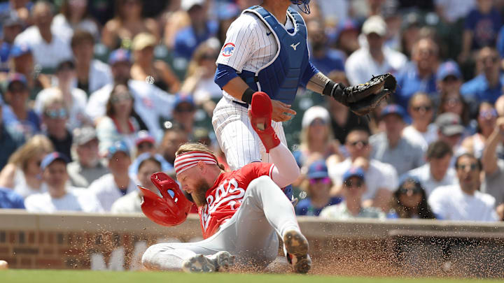 Jake Fraley slides in to score a run