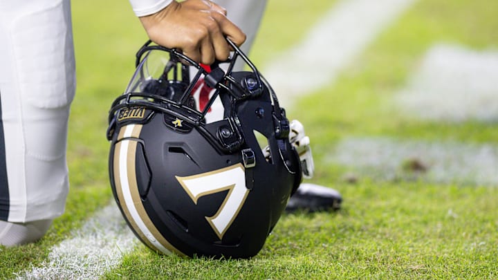 Nov 23, 2024; Baton Rouge, Louisiana, USA;  Detailed view of the Vanderbilt Commodores helmet on the turf against the LSU Tigers during the first half at Tiger Stadium. Mandatory Credit: Stephen Lew-Imagn Images